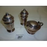 A three piece silver condiment set Sheff