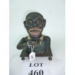 A novelty Blackamoor money box est: £50-