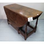 A 19c oak gate leg dining table with ova