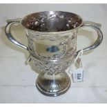 A Georgian silver two handled cup emboss