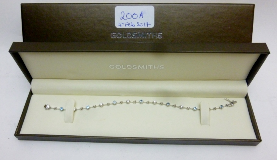 A diamond and aquamarine bracelet est: £