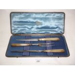 A silver handled three piece carving set