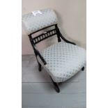 A late Victorian ebonised nursing chair