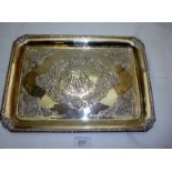 A silver dressing table tray with emboss