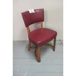 A mid 20c oak framed chair upholstered i