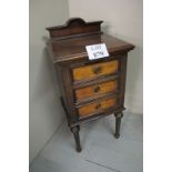 A Victorian walnut bedside chest of thre