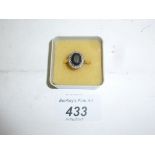 An 18ct gold sapphire and diamond ring (size N) est: £150-£200