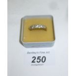 A 9ct gold ring inset with five graduated diamonds and four smaller diamonds (size N) est: