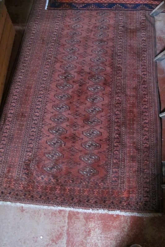 A Persian early 20c rug on Burgundy ground (174 x 104 cm approx) est: £30-£50