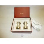 A salt and pepper mill marked Cartier Sterling boxed est: £80-£120