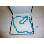 Turquoise howlite necklace (24 x 11 mm) beads 82 cm length est: £55-£85