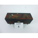 A Japanese lacquer musical jewellery box painted with peacock and a mountainous landscape with