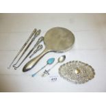 A silver embossed pin tray, a silver hand mirror,