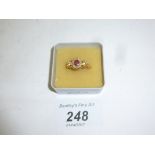 An 18ct gold ruby and diamond ring (size P) est: £300-£500