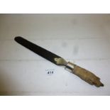 A ebony page turner with animal claw handle and silver mounts London 1929 est: £30-£50