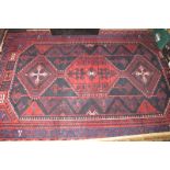 A mid 20c Persian carpet on red ground (260 x 172 cm approx) est: £150-£250
