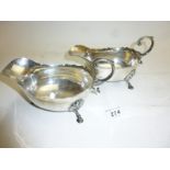 A pair of silver sauce boats with acanthus leaf handles and pad feet Chester 1900 est: £200-£280