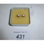 A pair of diamond solitaire earrings est: £300-£500