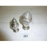 A silver embossed pepper pot Birmingham 1898 George Unite and another silver embossed pepper pot