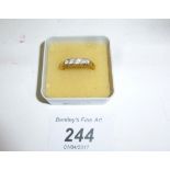 An 18ct gold five stone graduated diamond ring (size O) est: £300-£500