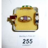 A collection of four rings to include an emerald ring and an amethyst and pearl ring est: £50-£80