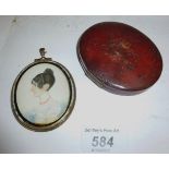 An oval framed miniature of a lady with a coral necklace cased est: £30-£50