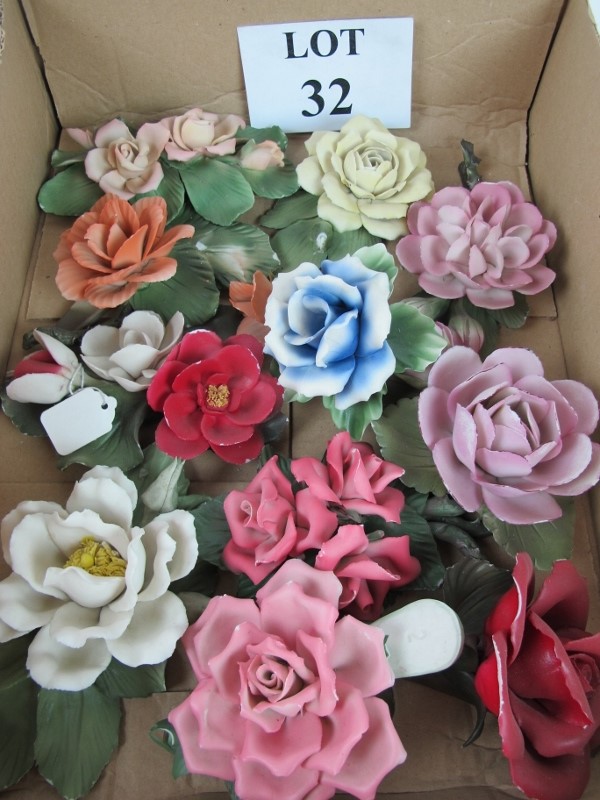 A collection of eleven Continental porcelain flowers est: £10-£15 (A3)