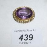 A large amethyst brooch set with seed pearls 9ct gold est: £80-£120