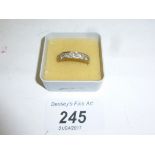 A 9ct gold 1/2 eternity ring set with seven diamonds (size N) est: £500-£800