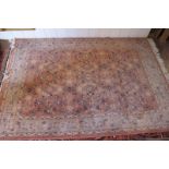 A 20c wool rug on pink and blue ground (200 x 140 cm approx) est: £50-£80