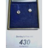 A pair of diamond solitaire earrings boxed est: £500-£800