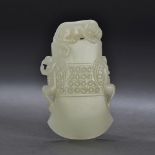 A Chinese white jade axe form pendant est: £2,400-£3,