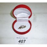 A three stone diamond set ring possibly 18ct (size N) boxed est: £200-£400