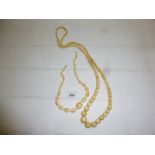 Two graduated ivory necklaces (one approx 40" long) est: £30-£50