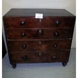 A 19c mahogany chest of four long graduated drawers with turned handles (one missing) est: £80-£120