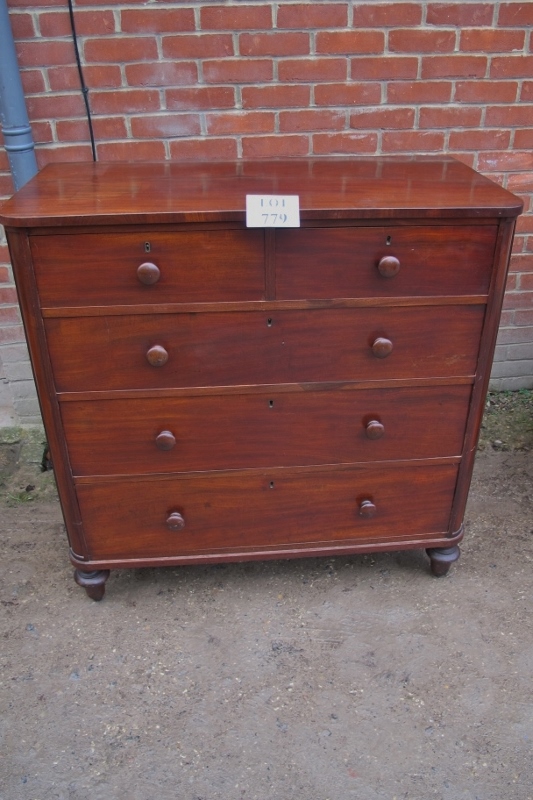 A Victorian mahogany chest of two short over three long drawers with turned handles and feet est:
