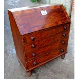 A 19c mahogany bureau with a fitted interior over four long drawers and turned feet est: £150-£250