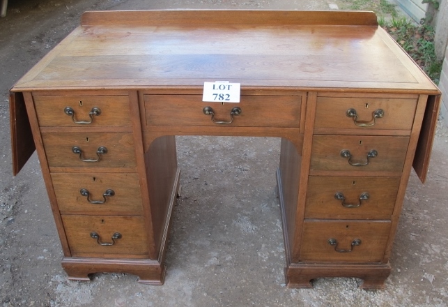 A c1900 oak/walnut writing desk with end drop leaves and nine drawers est: £200-£400 - Image 2 of 2