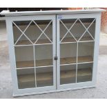 An early 19c painted bookcase with double glazed doors and shelves inside est: £100-£150
