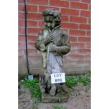 A garden statue of a man wearing a coat est: £30-£50