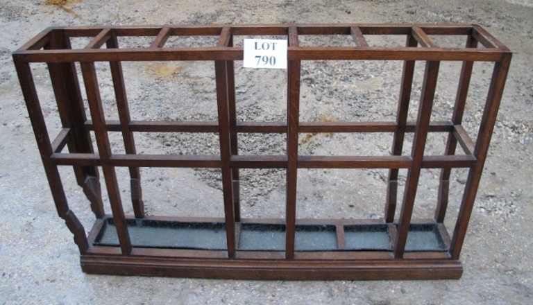 An early 20c oak umbrella stand with metal tray base est: £50-£80