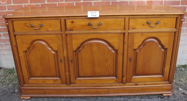 A large pine sideboard with drawers over cupboards est: £80-£120