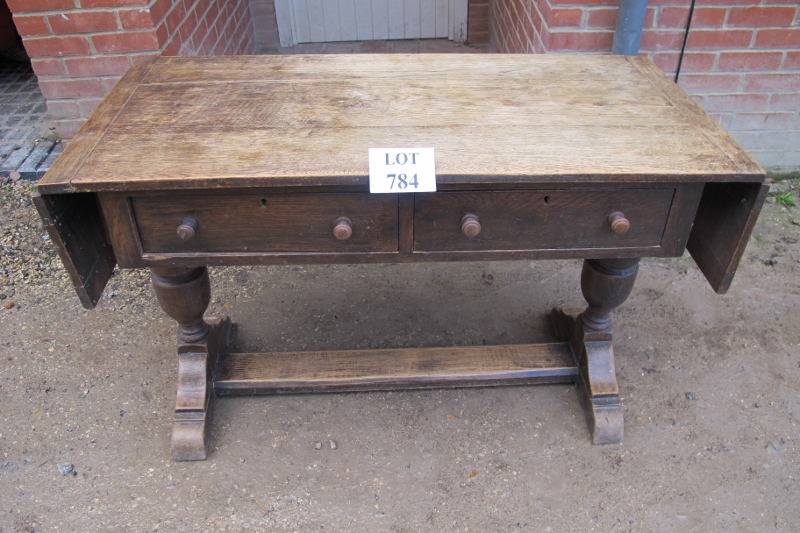 A 17c style oak hall table with drop leaf ends and two drawers est: £50-£80