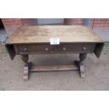 A 17c style oak hall table with drop leaf ends and two drawers est: £50-£80