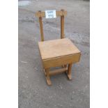 A 20c child's desk/chair with lift up seat compartment est: £20-£30