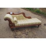 A Victorian mahogany chaise lounge with matching upholstered bolster cushion in clean condition