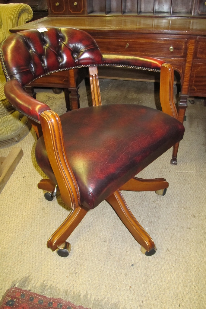 A 20c swivel desk chair with deep buttoned back est: £50-£80