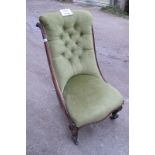 A Victorian mahogany framed nursing chair upholstered in green material est: £60-£90