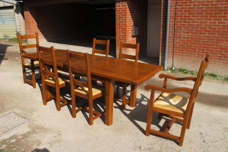 A late 20c pale oak dining table with six matching chairs all with rush seats and to include two - Image 2 of 3