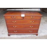 A fine George III mahogany chest of two short over three long drawers with brass swan handles and